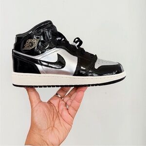 Nike Air Jordan 1 Mid Special Edition Black and Silver High-Top Sneakers